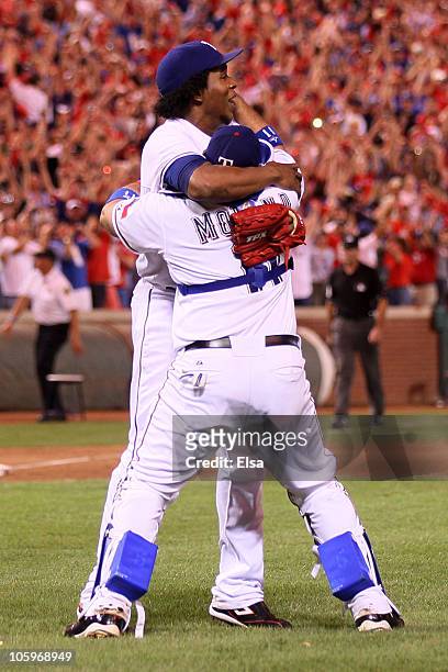 Bengie Molina and Neftali Feliz of the Texas Rangers celebrate after defeating the New York Yankees 6-1 in Game Six of the ALCS during the 2010 MLB...