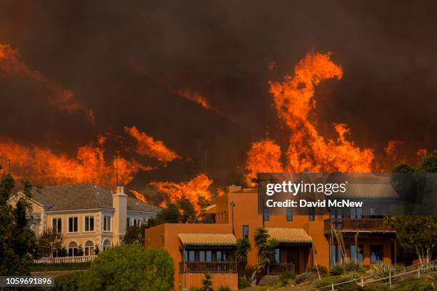 The Woolsey Fire approaches homes on November 9, 2018 in Malibu, California. About 75,000 homes have been evacuated in Los Angeles and Ventura...