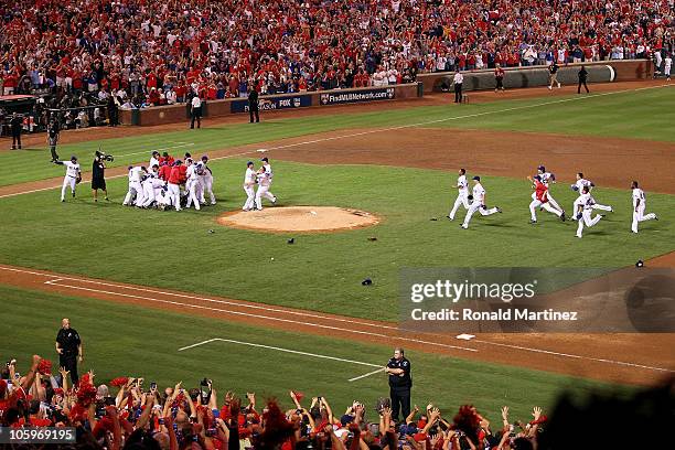 The Texas Rangers celebrate on the field after defeating the New York Yankees 6-1 in Game Six of the ALCS to advance to the World Series during the...