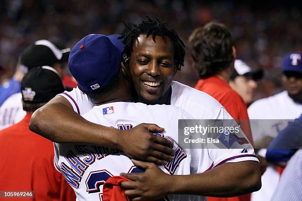 Vladimir Guerrero of the Texas Rangers celebrates with Manager Ron Washington after the Rangers won 6-1 against the New York Yankees in Game Six of...