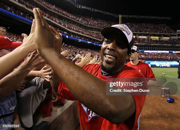 Vladimir Guerrero of the Texas Rangers celebrates with fans after defeating the New York Yankees 6-1 in Game Six of the ALCS to advance to the World...