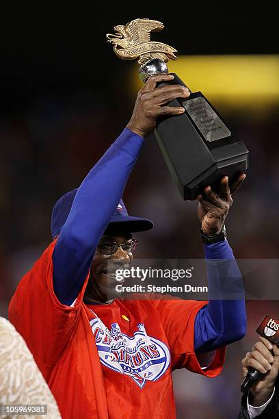 Manager Ron Washington of the Texas Rangers holds the Warren C. Giles Trophy after defeating the New York Yankees 6-1 in Game Six of the ALCS to...