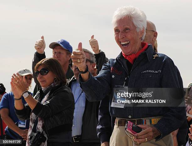 Future space tourists led by Wally Funk , who have paid their deposits on the $200,000.00 fare, celebrate before the Virgin Galactic VSS Enterprise...