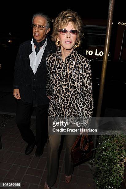Actress Jane Fonda and record producer Richard Perry, arrives at a launch party at for Rod Stewart's Album "Fly Me To The Moon... The Great American...