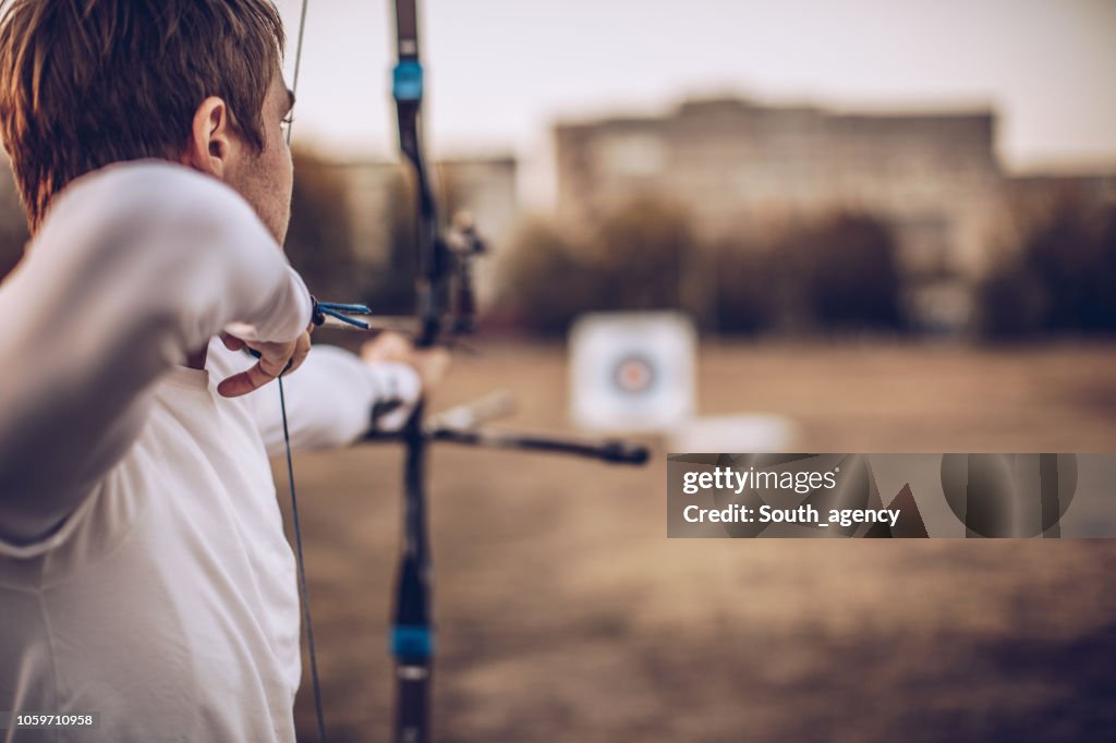 Man aiming at target
