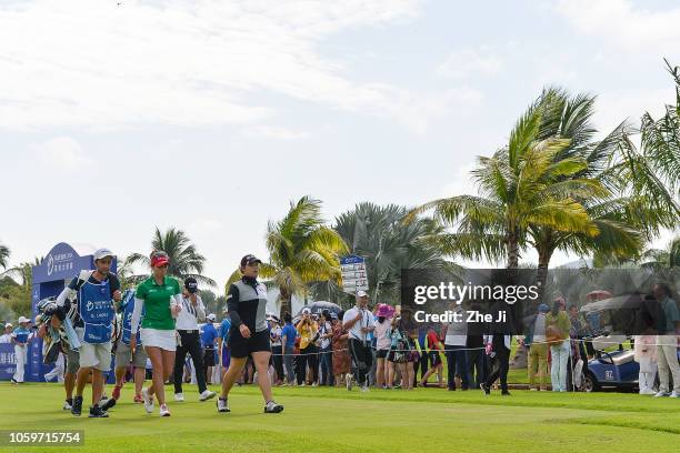 Gaby Lopez of Mexico and Ariya Jutanugarn of Thailand play a shot on the 1st hole during the final round of the Blue Bay LPGA on November 10, 2018 in...