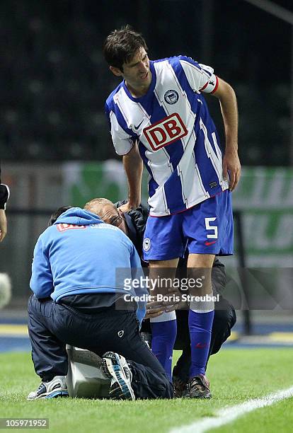 Andre Mijatovic of Berlin leaves the pitch after picking up an injury during the Second Bundesliga match between Hertha BSC Berlin and SpVgg Greuther...