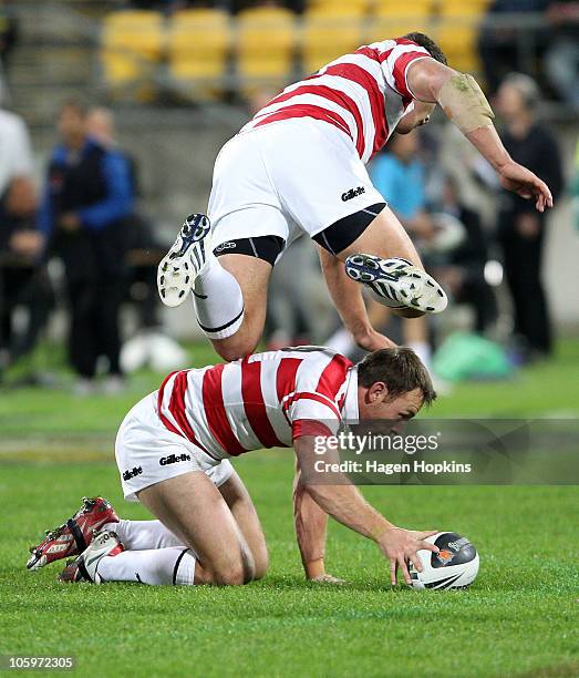 Gareth Ellis of England flies over teammate James Roby during the Four Nations match between the New Zealand Kiwis and England at Westpac Stadium on...
