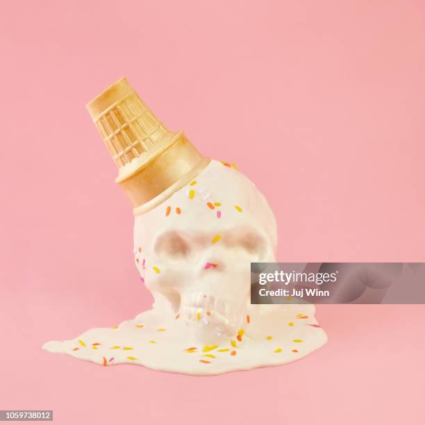 upside down ice cream cone with skeleton face - ice cream sprinkles stock pictures, royalty-free photos & images