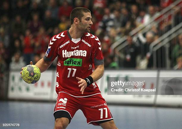 Chen Pomeranz of Ahlen-Hamm passes the ball during the Toyota Handball Bundesliga match between HSG Ahlen-Hamm and THW Kiel at the Maxipark Arena on...