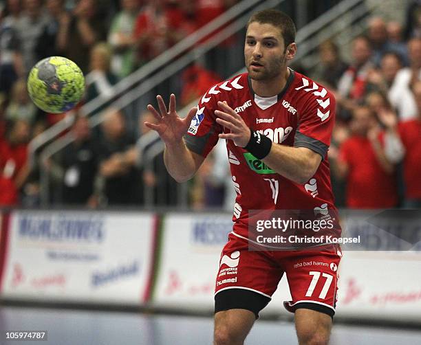 Chen Pomeranz of Ahlen-Hamm passes the ball during the Toyota Handball Bundesliga match between HSG Ahlen-Hamm and THW Kiel at the Maxipark Arena on...