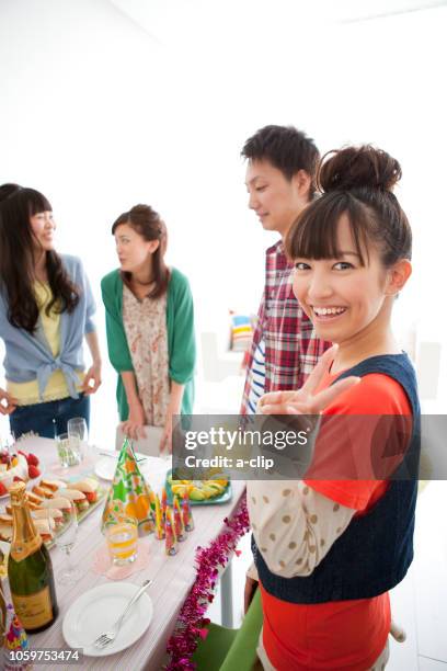 four men and women around the party table - a womans vigna imagens e fotografias de stock