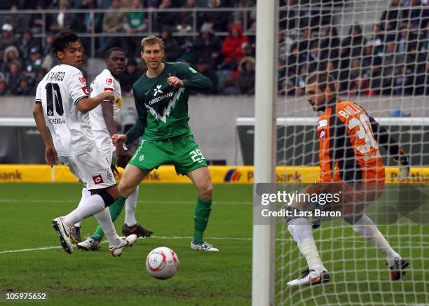 Marko Marin of Bremen scores his teams first goal past goalkeeper Logan Bailly of Moenchengladbach during the Bundesliga match between Borussia...