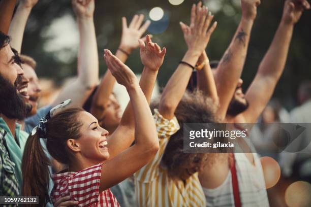 standing ovation at a concert. - concert stock pictures, royalty-free photos & images