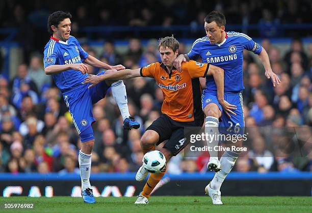 Dave Edwards of Wolverhampton Wanderers is closed down by Yury Zhirkov and John Terry of Chelsea during the Barclays Premier League match between...