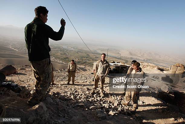 Marine squad leader Sgt. Philip Percesepe of Poughkeepsie, NY with India Battery, 3rd Battalion, 12th Marine Regiment talks to his men as they finish...