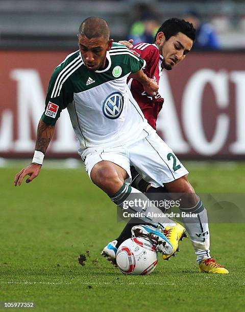 Ilkay Guendogan of Nuernberg fights for the ball with Ashkan Dejagah of Wolfsburg during the Bundesliga match between 1. FC Nuernberg and VfL...