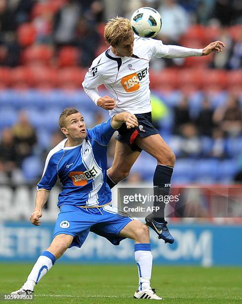 Wigan Athletic's English midfielder Tom Cleverley vies with Bolton Wanderers' US midfielder Stuart Holden during the English Premier League football...