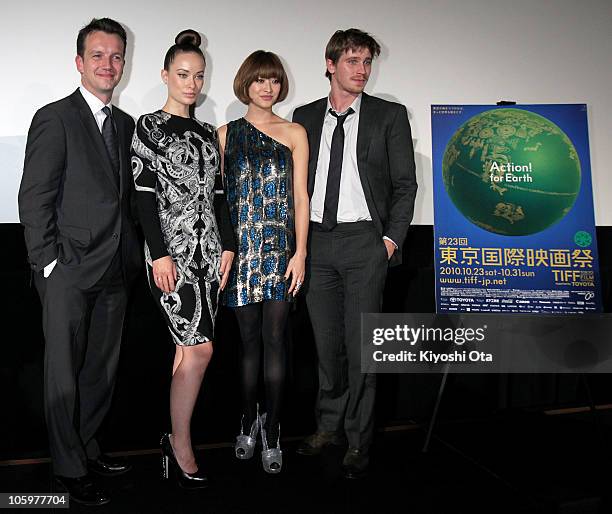 Producer Sean Bally, actress Olivia Wilde, model Yu Yamada and actor Garrett Hedlund pose during the 'Tron: Legacy' 3D special presentation as part...