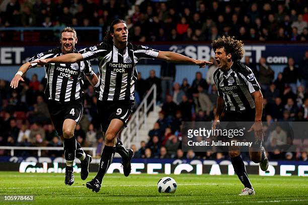 Andrew Carroll of Newcastle United celebrates scoring their second goal during the Barclays Premier League match between West Ham United and...