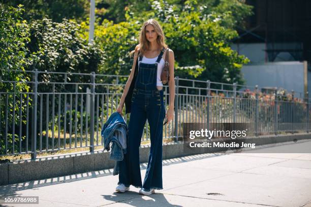 Model Sarah Berger wears denim overalls and a white tanktop during New York Fashion Week Spring/Summer 2019 on September 06, 2018 in New York City.