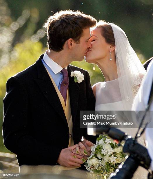 Harry Meade and Rosie Bradford kiss as they leave the Church of St. Peter and St. Paul on October 23, 2010 in Northleach near Cheltenham, England.