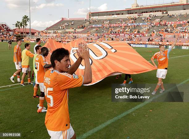 Brian Ching and the Houston Dynamo salute the fans on fan appreciation day as they play the Seattle Sounders at Robertston Stadium on October 23,...