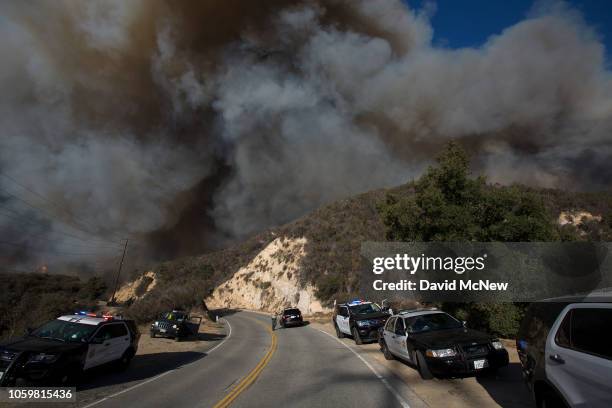 Wind-driven flames move across Malibu Creek State Park during the Woolsey Fire on November 9, 2018 near Malibu, California. After a experiencing a...