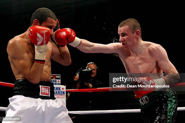 Peter McDonagh of Bermondsey throws and lands his punch on Curtis Woodhouse of Driffield in the Light-Welterweight bout at York Hall on October 23,...