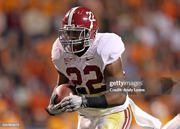 Mark Ingram of the Alabama Crimson Tide runs with the ball during the SEC game against the Tennessee Volunteers at Neyland Stadium on October 23,...