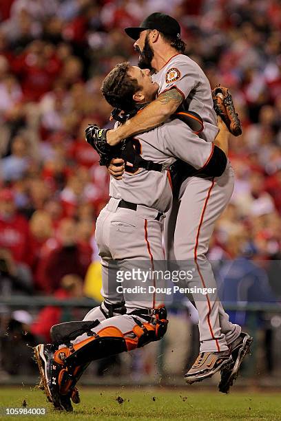Buster Posey and Brian Wilson of the San Francisco Giants celebrate defeating the Philadelphia Phillies 3-2 and winning the pennant in Game Six of...
