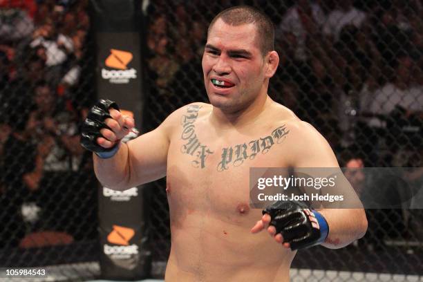 Cain Velasquez celebrates after defeating Brock Lesnar by TKO in the first round to become the new UFC heavyweight champion after their heavyweight...