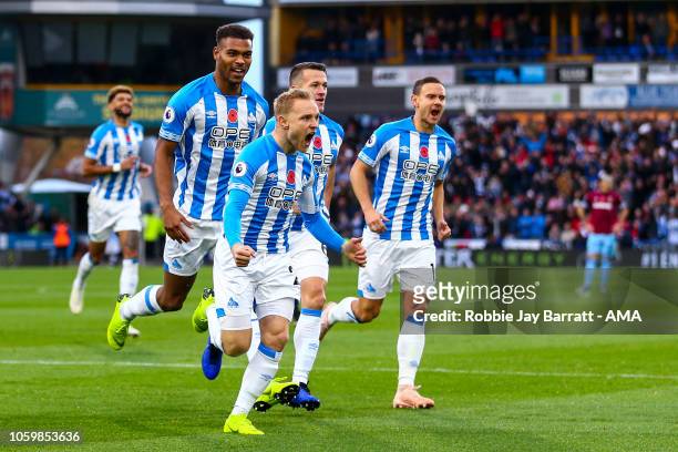 Alex Pritchard of Huddersfield Town celebrates after scoring a goal to make it 1-0 during the Premier League match between Huddersfield Town and West...