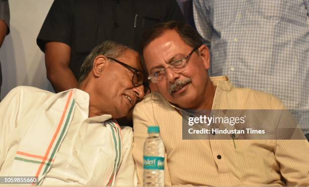 Senior congress leader Digvijaya Singh having a word with Ajay Singh during the release of party election manifesto for the upcoming Madhya Pradesh...