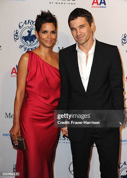 Actress Halle Berry and Olivier Martinez arrive at the 32nd Anniversary Carousel Of Hope Gala at the Beverly Hilton Hotel on October 23, 2010 in...