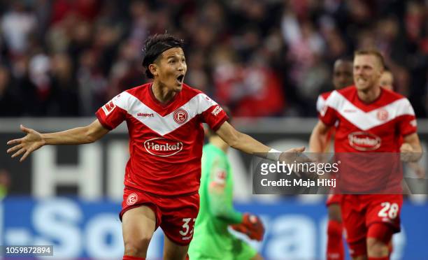 Takashi Usami of Fortuna Duesseldorf celebrates after scoring his team's first goal during the Bundesliga match between Fortuna Duesseldorf and...