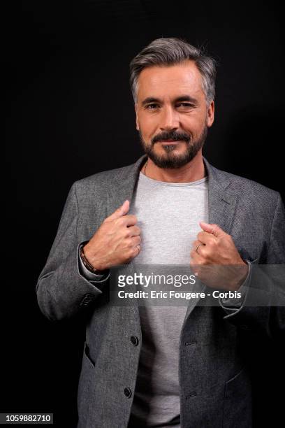 Presenter Olivier Minne poses during a portrait session in Paris, France on .