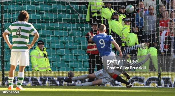 Kenny Miller of Rangers scores his teams third goal from the penalty spot during the Clydesdale Bank Premier League match between Celtic and Rangers...