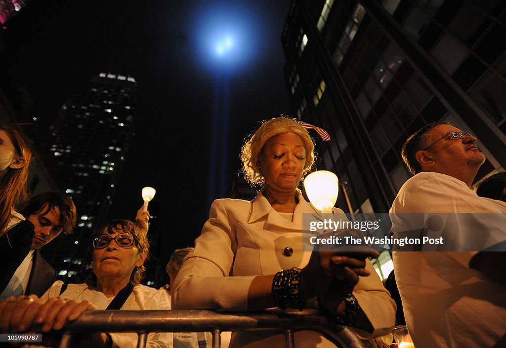 Candlelight vigil is held near controversial proposed mosque by Ground Zero on the eve of 9/11 anniversary.