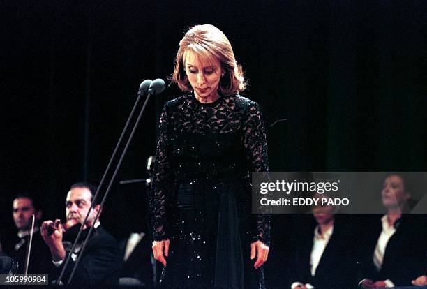 Lebanese diva Fairuz performs at the American University auditorium in Dubai 29 March 2001. Fairuz is accompanied by a 40-member orchestra and...