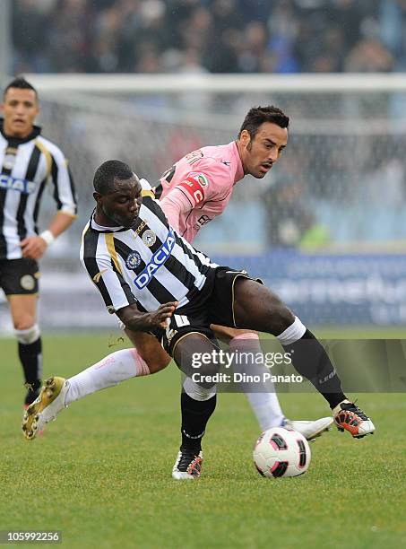Kwadwo Asamoah of Udinese battles for the ball with Mattia Cassani of Palermo during the Serie A match between Udinese Calcio and US Citta di Palermo...