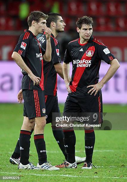 Daniel Schwaab, Eren Derdiyok and Patrick Helmes of Leverkusen look dejected after losing the Bundesliga match between Bayer Leverkusen and FSV Mainz...