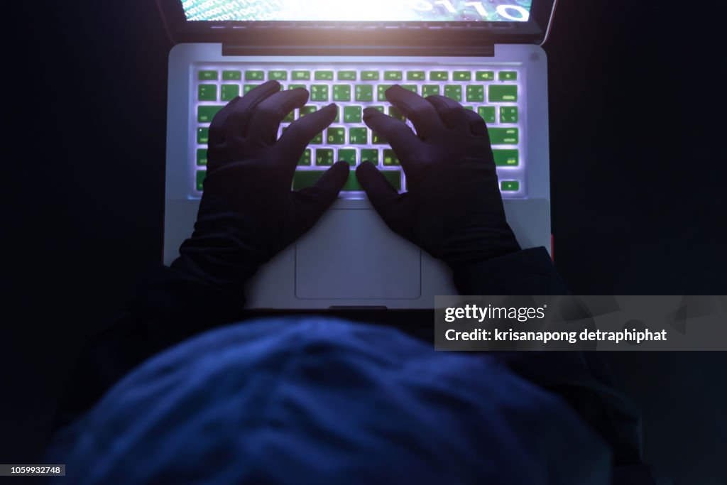 Hacker on a laptop,Data theft