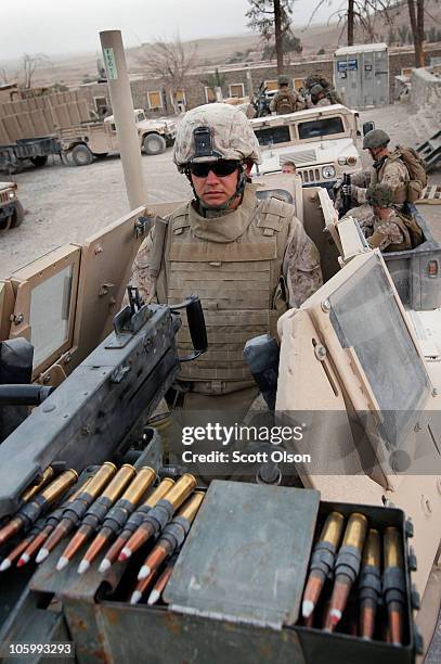 Marine Cpl. Daniel Hauser of Maple Grove, MN with India Battery, 3rd Battalion, 12th Marine Regiment prepares to escort a patrol outside Forward...