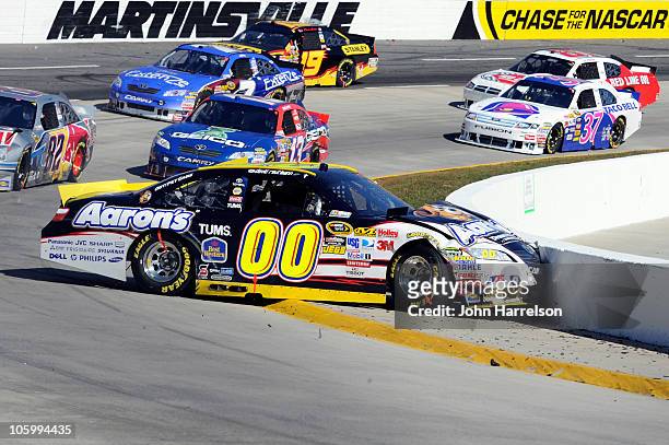 David Reutimann, driver of the Aaron's Dream Machine Toyota, hits the wall around the inside of turn four after an incident in the NASCAR Sprint Cup...