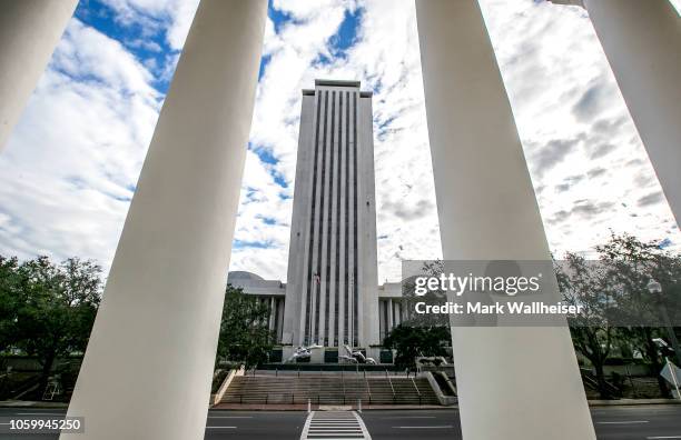 View of the Florida State Capitol building through the columns of the Florida Supreme Court November 10, 2018 in Tallahassee, Florida. Three close...