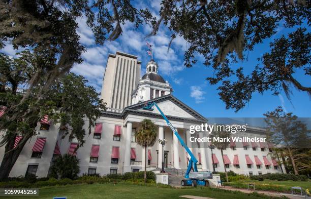 Workers repair the damage from Hurricane Michael to the historic Old Florida State Capitol building, which sits in front of the current New Capitol...