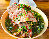 Hot and spicy soup with pork neck bones and Thai herbs that we called 