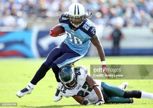 Chris Johnson of the Tennessee Titans runs with the while defended by Asante Samuel of the Philadelphia Eagles at LP Field on October 24, 2010 in...