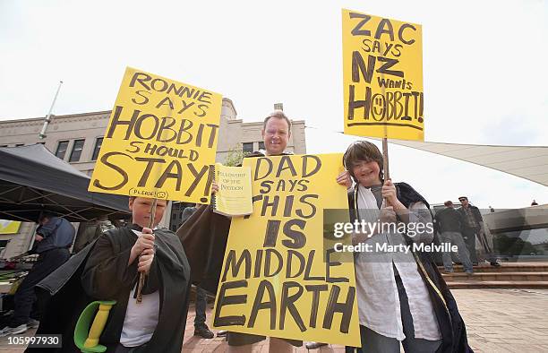 Hobbit supporters hold up posters in support of the Hobbit movie at Civic Square on October 25, 2010 in Wellington, New Zealand. Stakeholders of the...